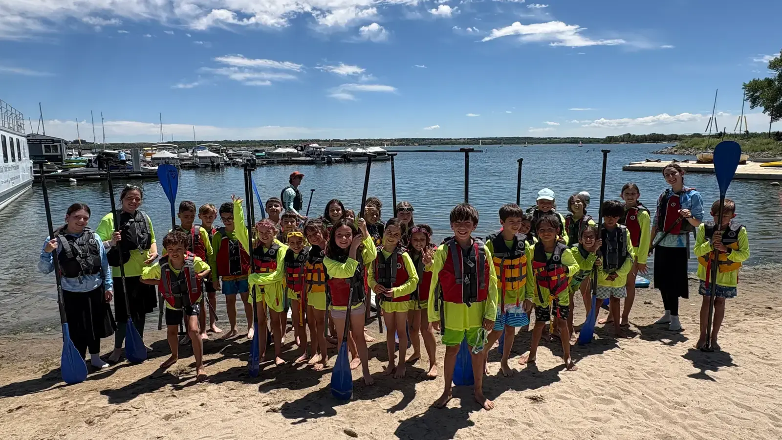 The whole camp lined up in life jackets at the lake